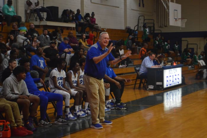 Bolton coach Fred Eloi instructs his Bears from the bench.